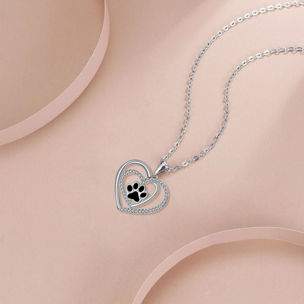 Copper dog paw print necklace with heart motif on cross chain for women