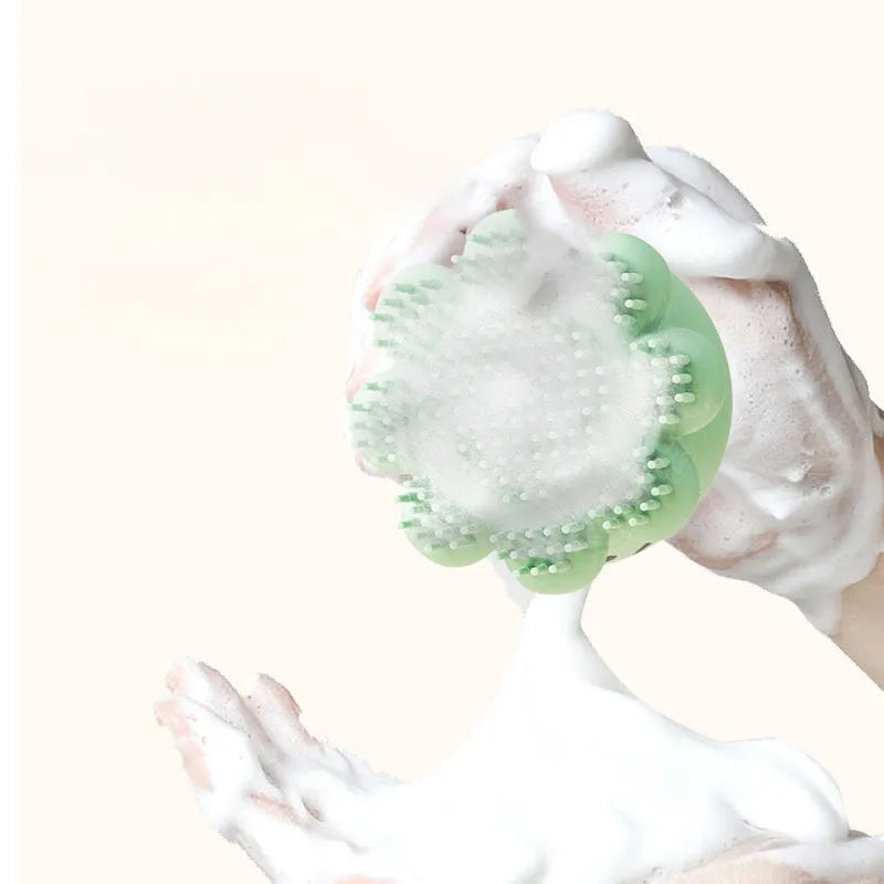 Green pet bath brush with built-in body wash reservoir and soft silicone bristles for dog and cat grooming