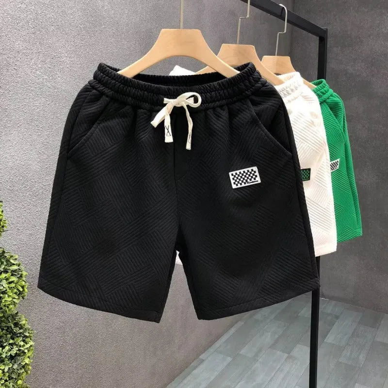 Casual polyester sports shorts with micro elasticity in black, white or green colours