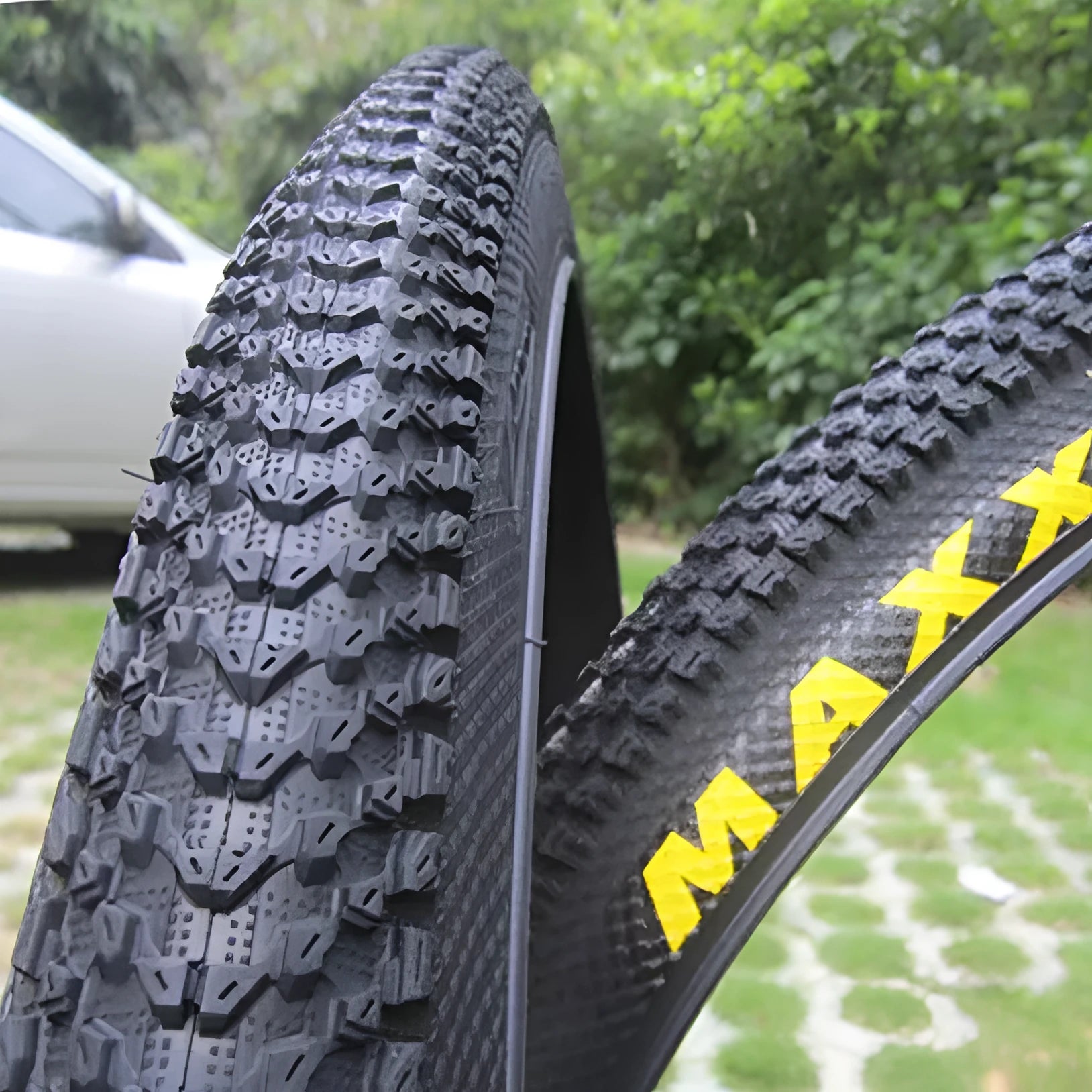 Ultralight puncture-resistant mountain bike tyre showing tread pattern and available sizes