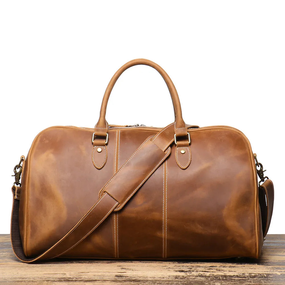 Retro genuine leather travel bag in vintage brown with sewing line detailing and shoulder strap