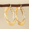Geometric ring design ear clips for women in metallic colours with clip-on backs