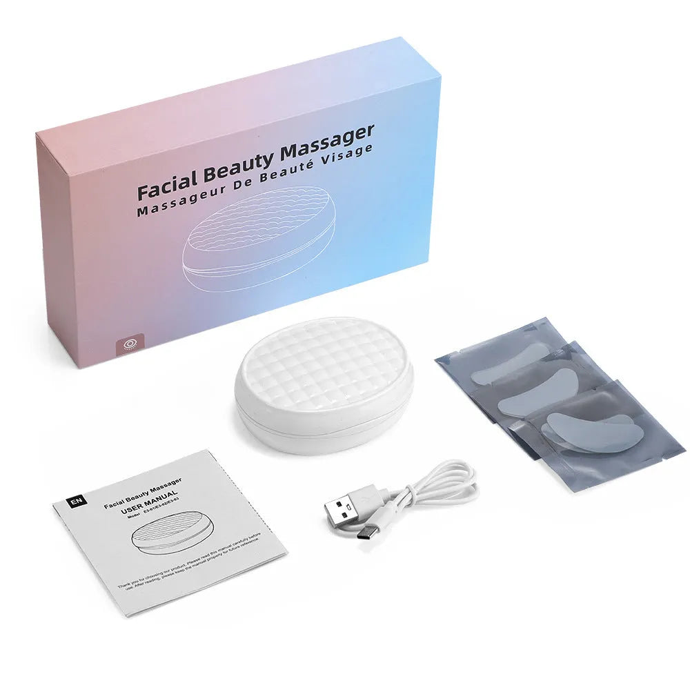 White wireless red light eye and facial massager device for dark circles treatment