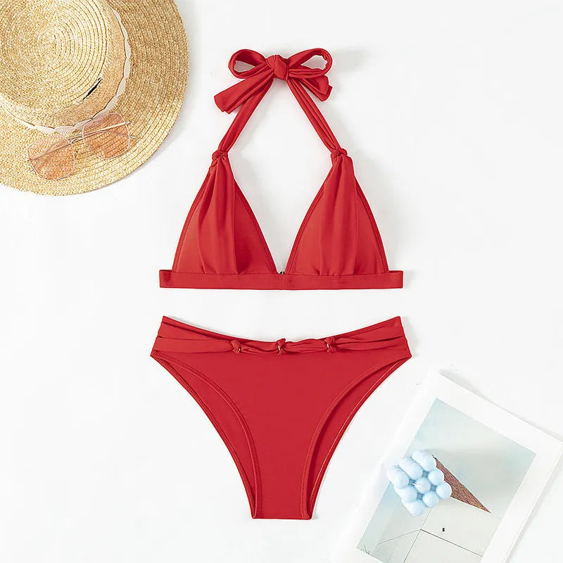 Red women's bikini with lace-up halterneck top and high-cut leg shorts