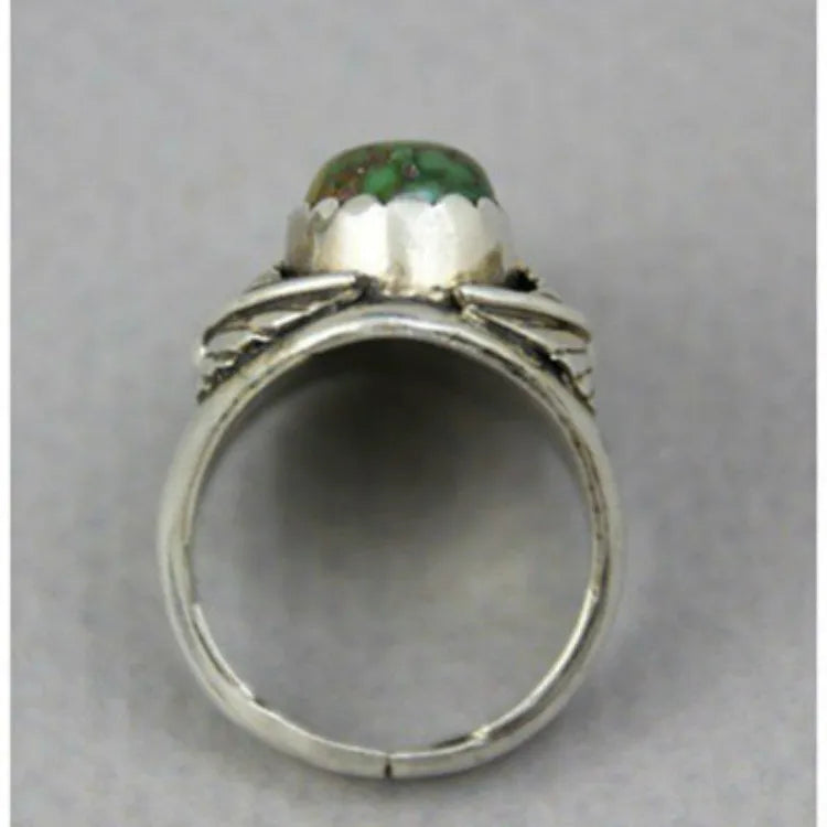Turquoise geometric retro ring for women on a white background, showing inlaid design.
