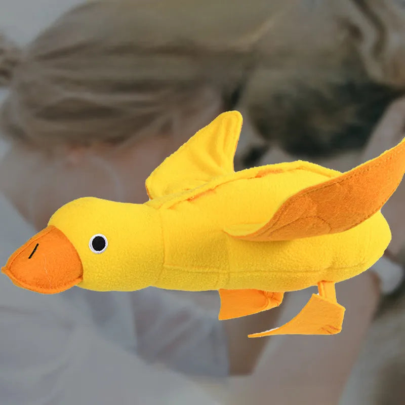 Yellow teddy bear duck plush dog toy with squeaker and treat holes.
