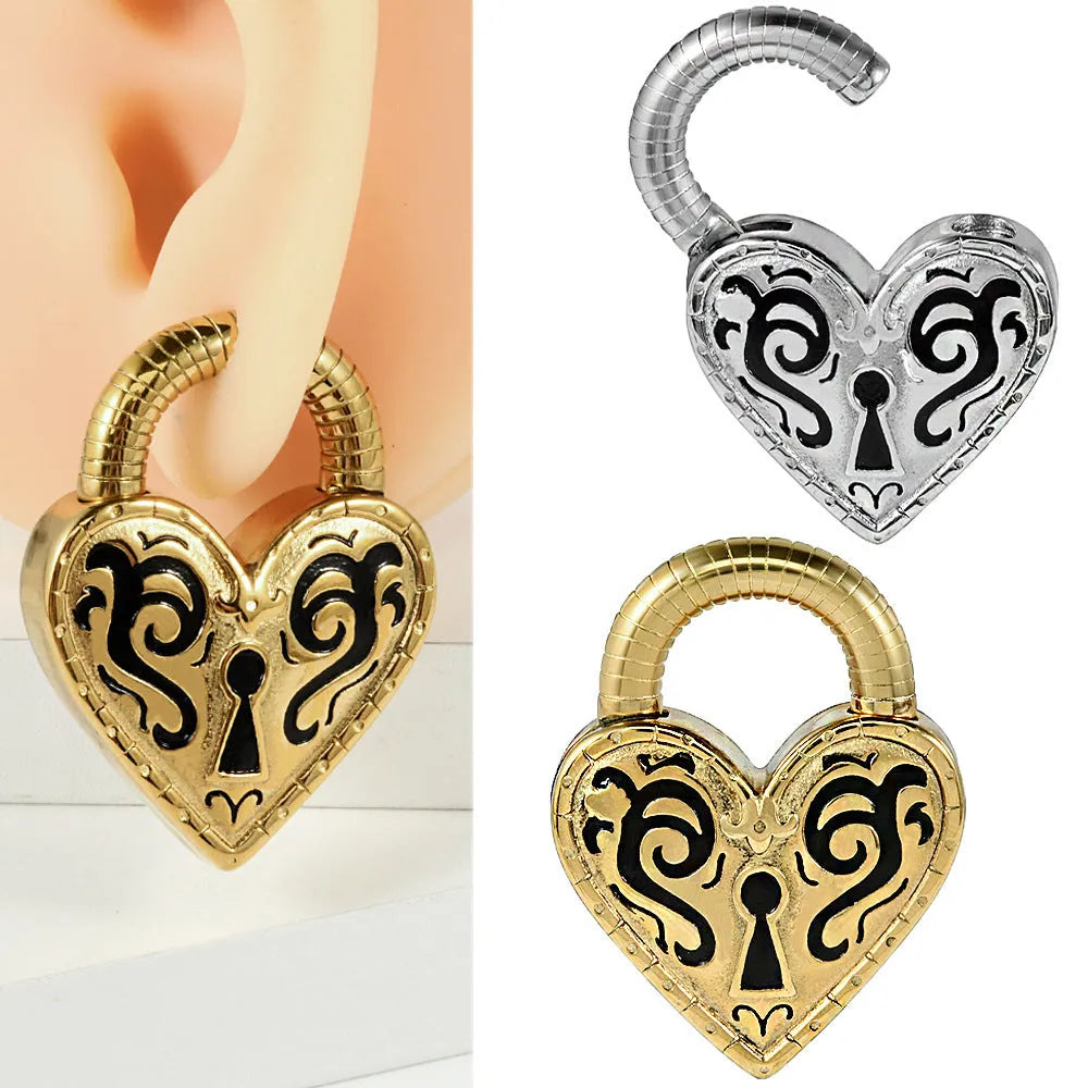 A pair of women's heart-shaped earrings in stainless steel with a gold electroplated finish.