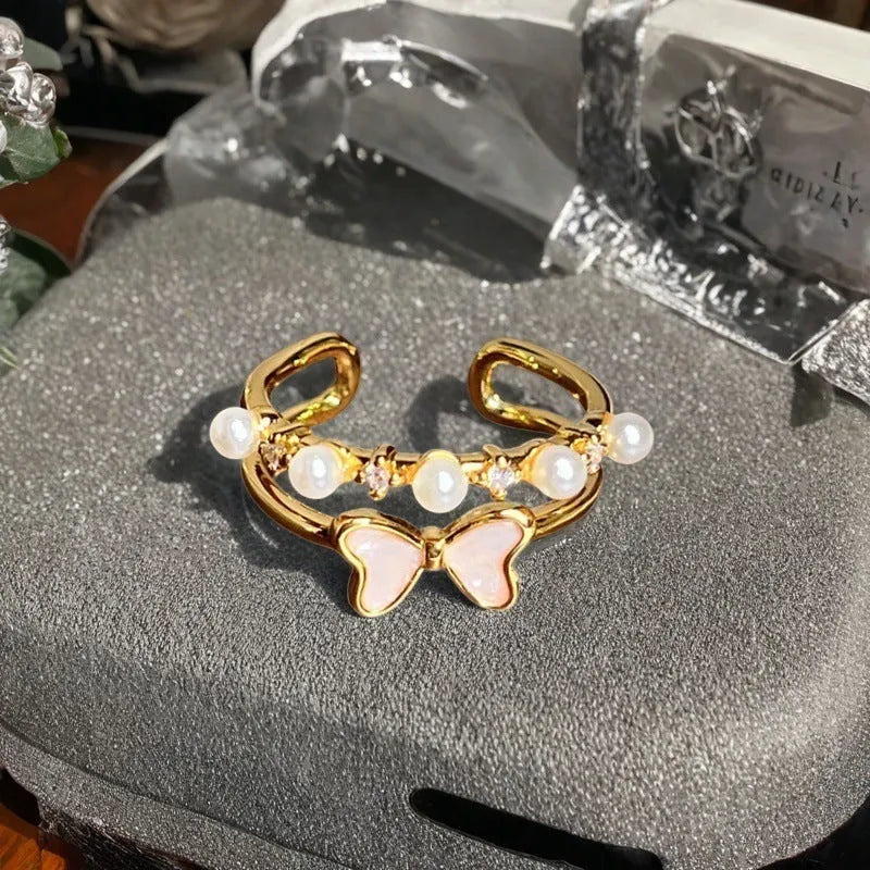 Adjustable gourd vintage ring with oil dripping finish in New Chinese style showing bow-shaped elements and zircon details