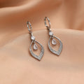 Copper water drop tassel earrings with a zircon stone and gold or silver ear buckles.