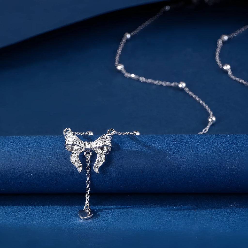925 sterling silver necklace with a detailed butterfly and heart-shaped pendant on an adjustable O-ring chain.