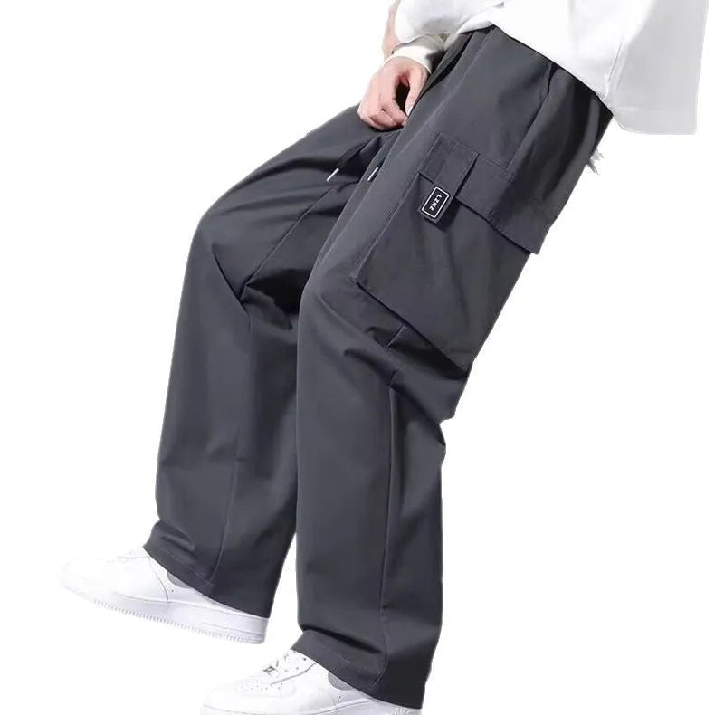Boys' straight-leg cargo pants in army green with drawstring waist and multiple large pockets.