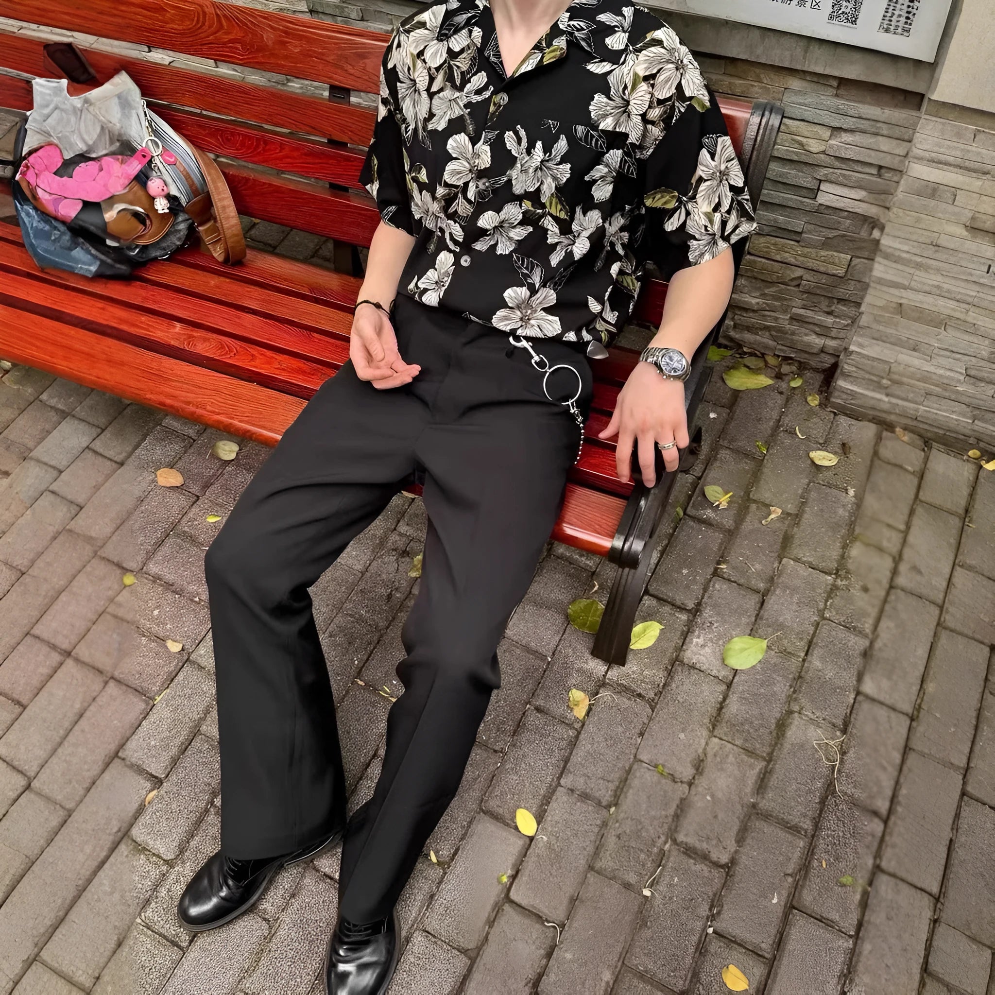 Black men's short sleeve shirt with floral print, Cuban collar, and loose cardigan fit.