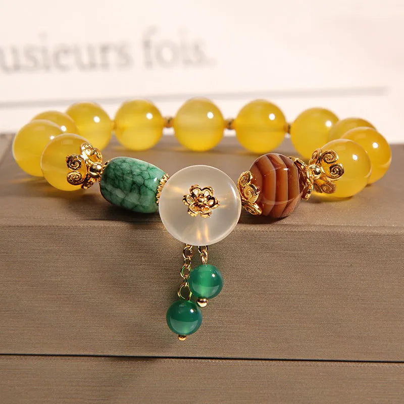 Khaki yellow agate crystal bead bracelet on an adjustable gold silk cord.