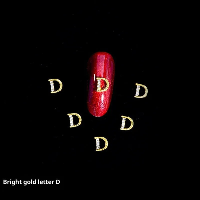 Gold alloy letter A nail ornament charm with crystal detail on a square chain base