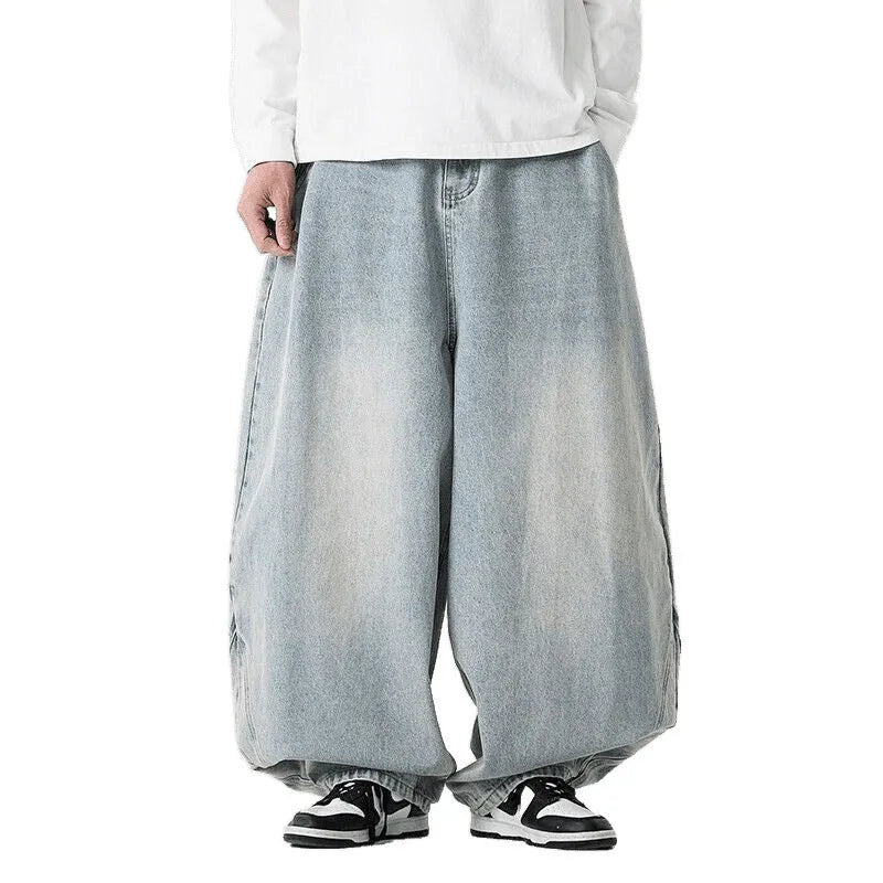 Men's plus size baggy jeans in dark blue denim with a straight leg and low waist.