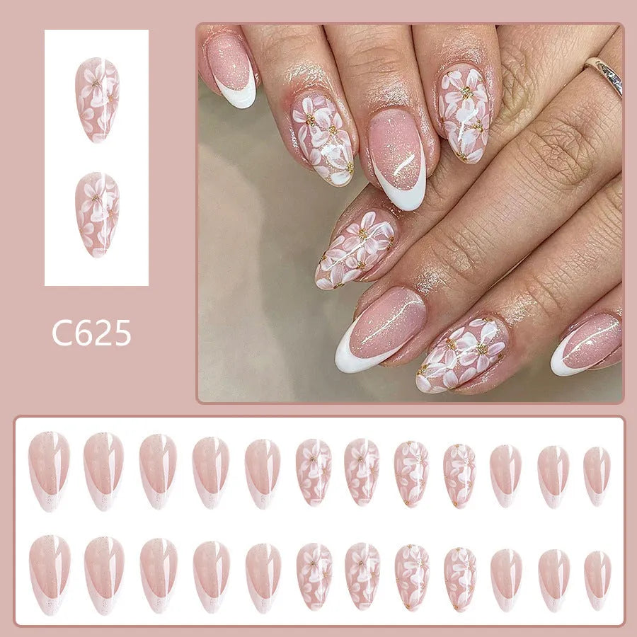 Short almond shaped artificial nails with French style and glittering powder flower design in C625 colour
