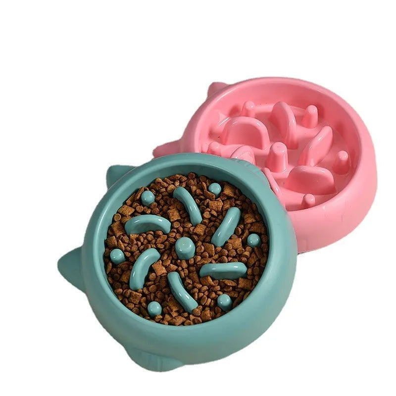 Green pet slow feeder bowl with raised bone-shaped obstacles inside to slow down eating.