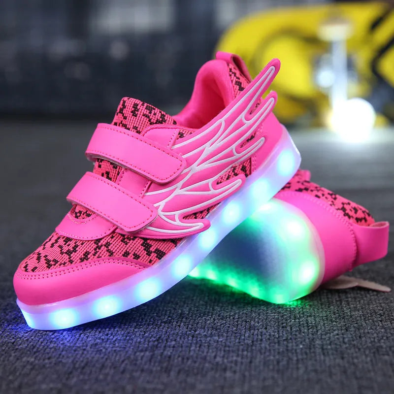 Children's plum red and white LED light-up sneakers with USB charging port visible