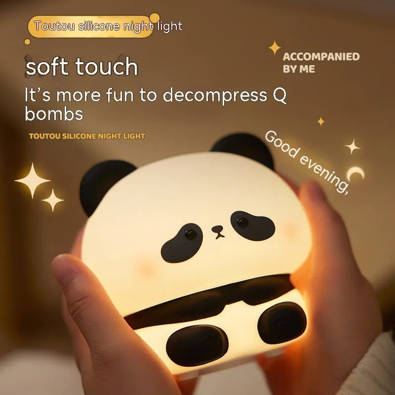 Panda LED night light with soft silicone head, USB rechargeable, touch control, colourful lights, on a bedside table