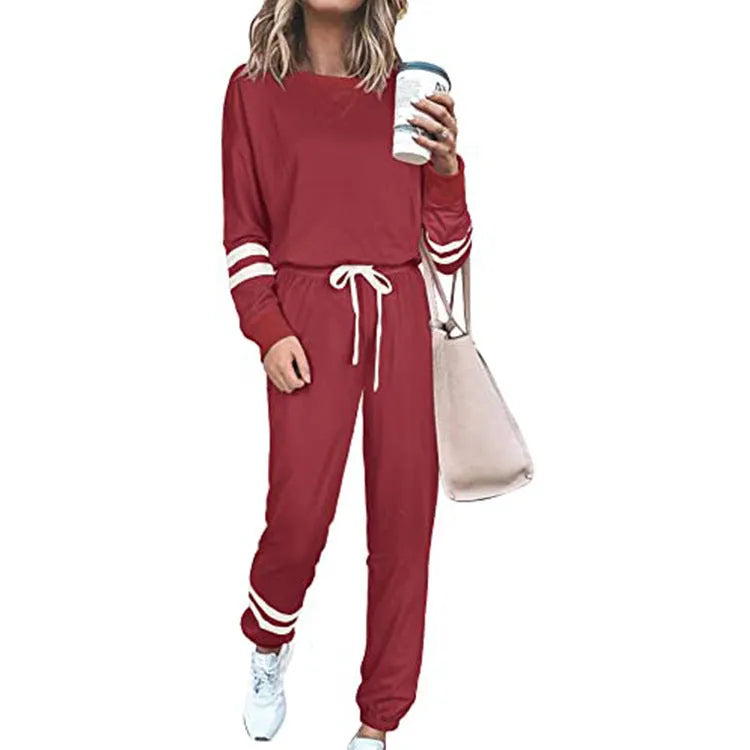 Women's plus size casual two-piece suit set in a solid colour, showing loose-fitting long sleeve top and trousers.