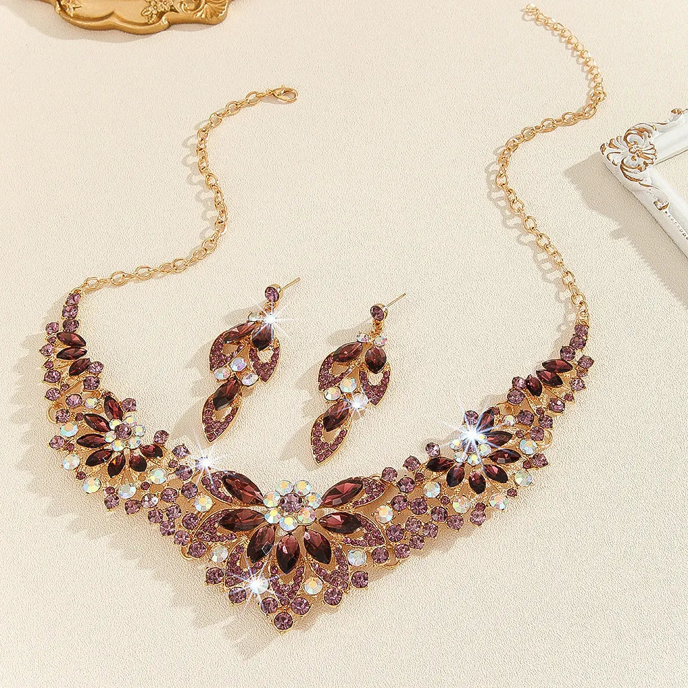 Gold high profile crystal necklace and earrings suite with exaggerated flower and wheat design on alloy