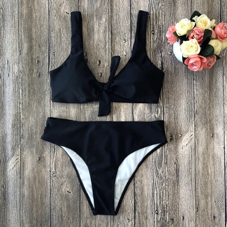 Women's solid colour bikini set showing bra top and matching panties in polyester fabric