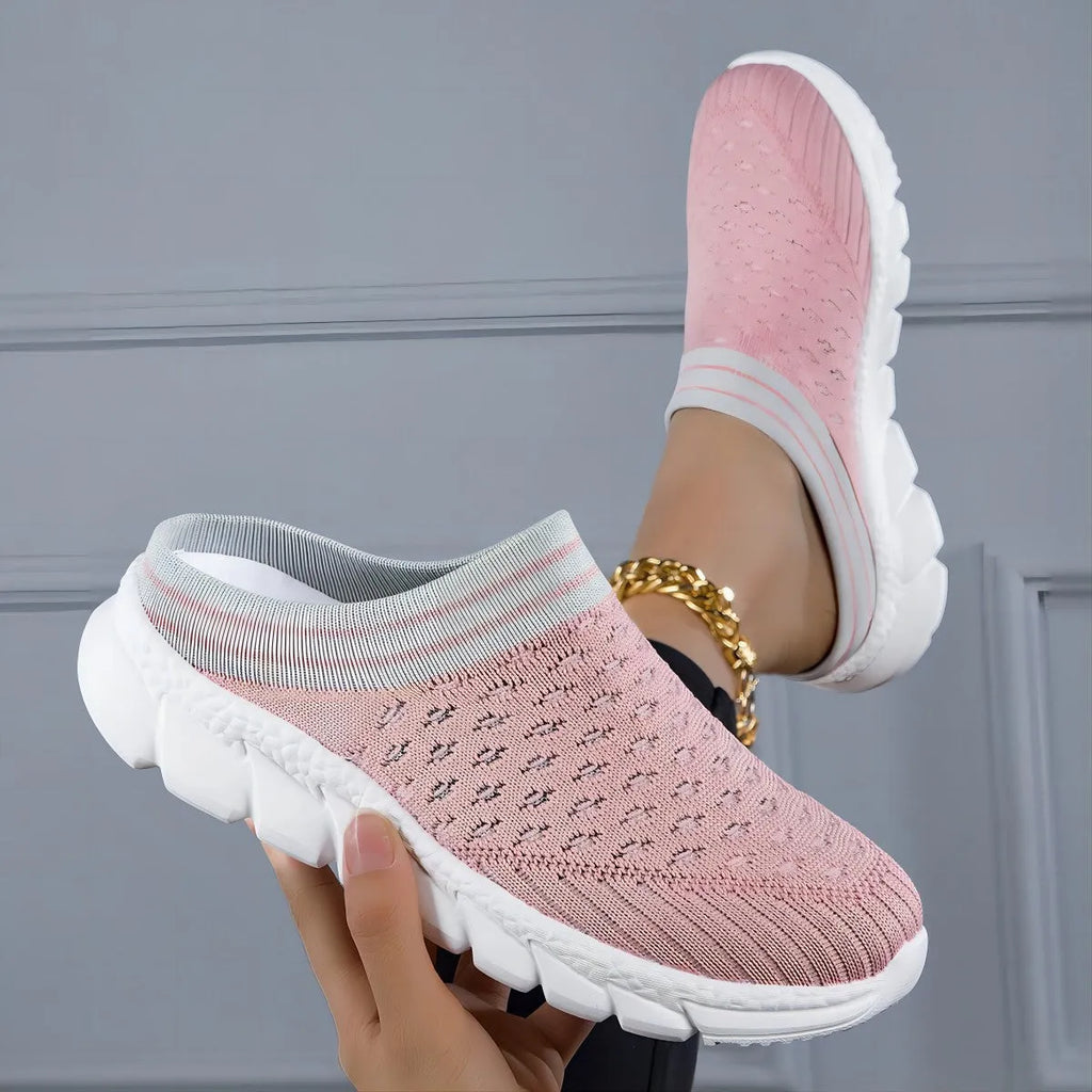 Women's black flyknit semi-slipper sock shoes with striped pattern and hollowed-out sewing lines on a lightweight sole.