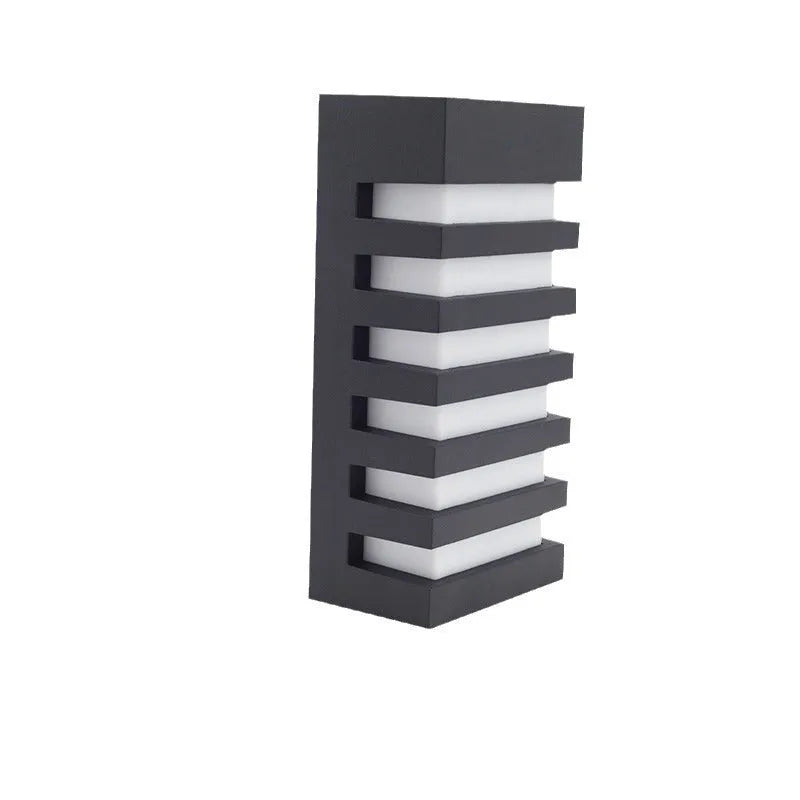 Modern minimalist aluminium outdoor wall lamp mounted on an exterior wall.