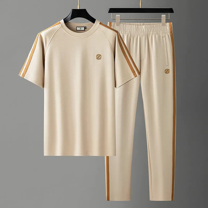 Men's blue ice silk style short sleeve suit set with top and pants for sports.