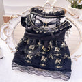Golden polyester gothic princess style dress for a small dog on a mannequin.