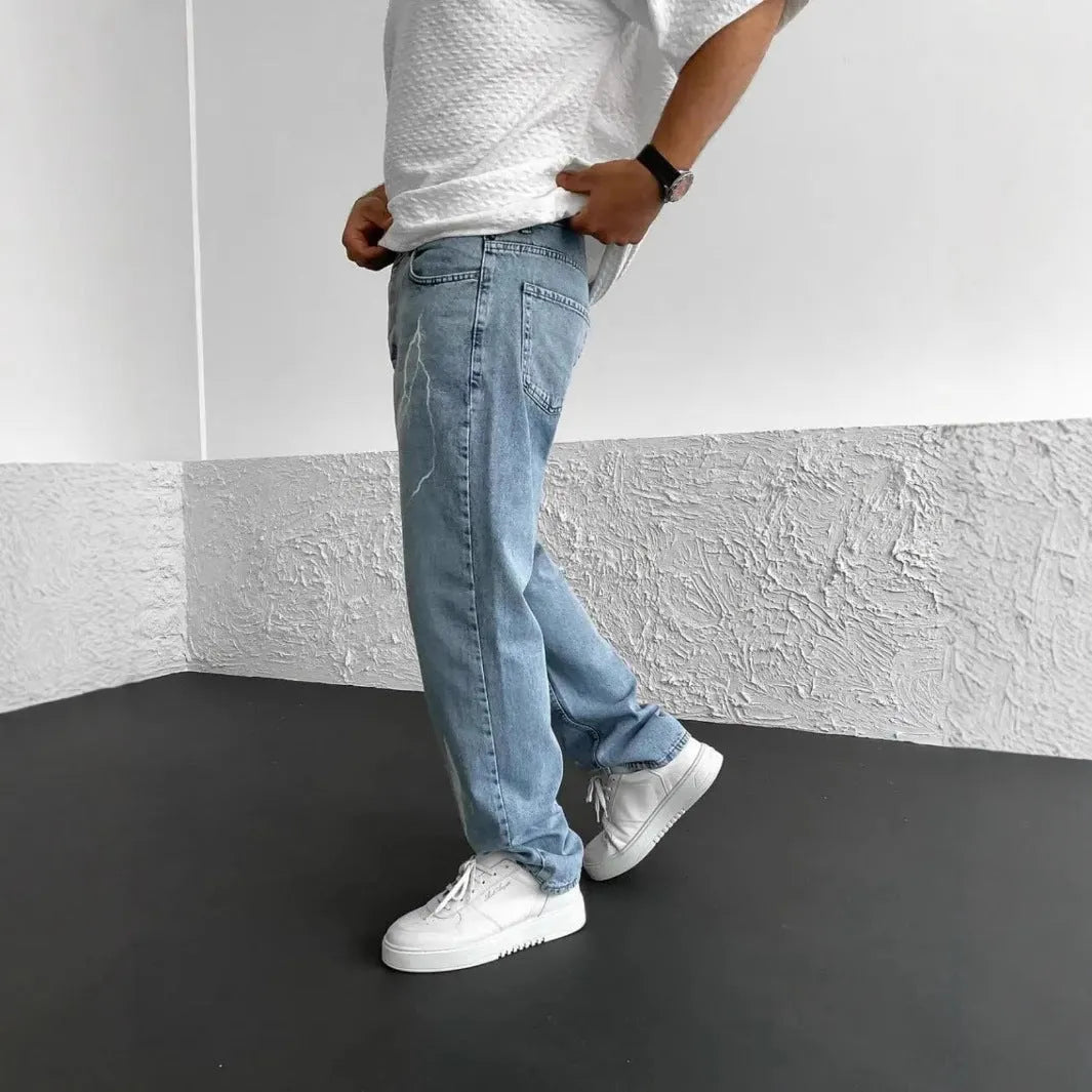 Men's straight-leg denim jeans in medium wash blue with zipper fly and mid-waist design