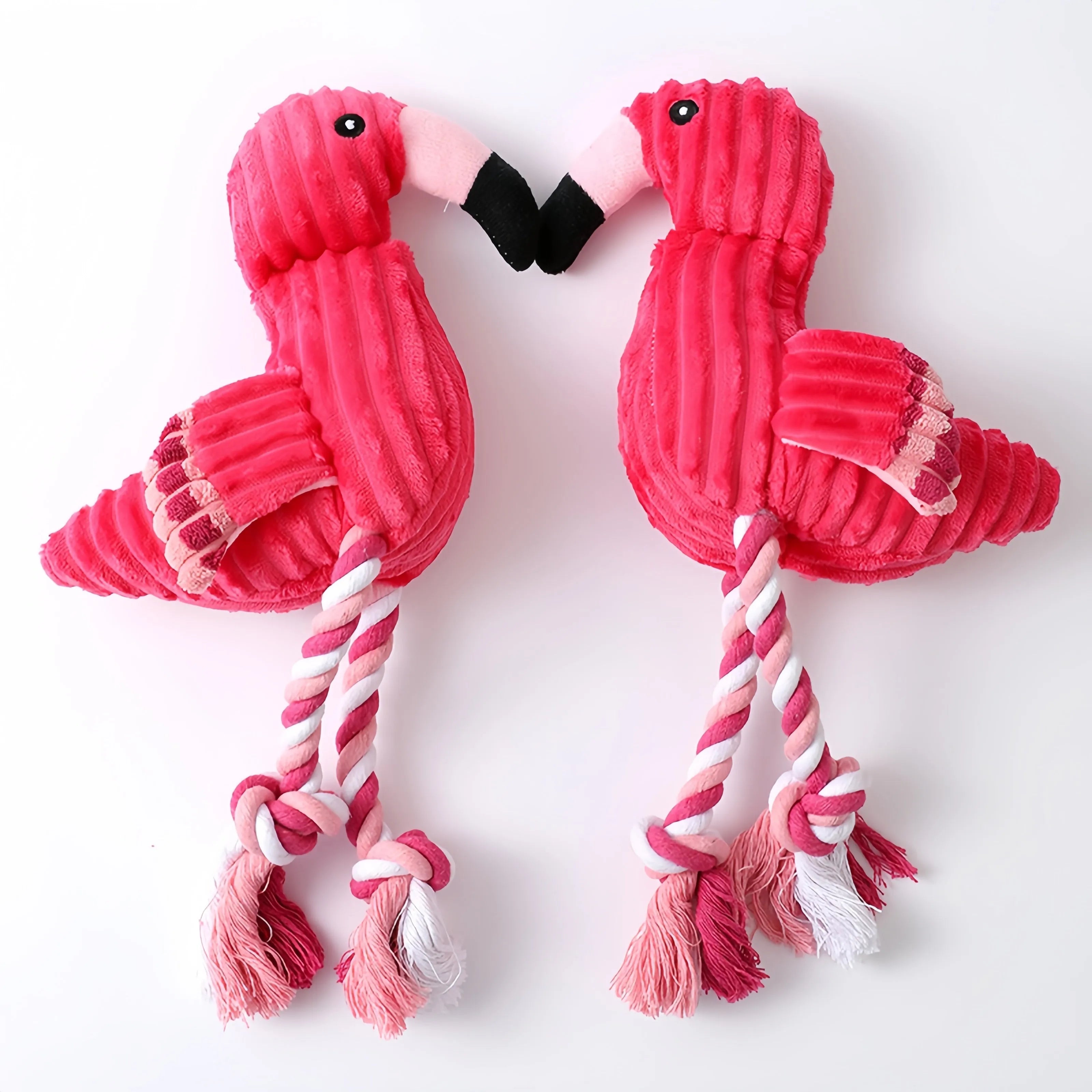 Pink corduroy animal-shaped squeaky dog toy showing elephant, owl, and giraffe designs