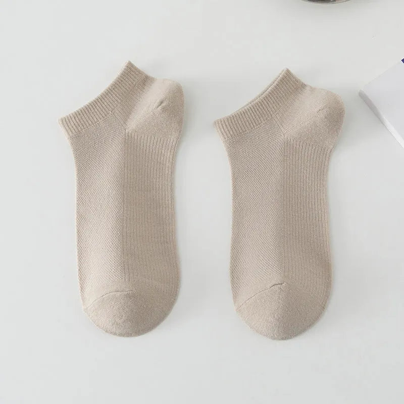 Men's low-cut solid colour boat socks made from breathable polyester, shown in one of six available colour options.