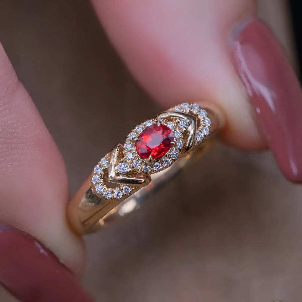 S925 sterling silver ring in yellow gold with geometry shape and diamond treatment on a plain background
