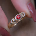 S925 sterling silver ring in yellow gold with geometry shape and diamond treatment on a plain background