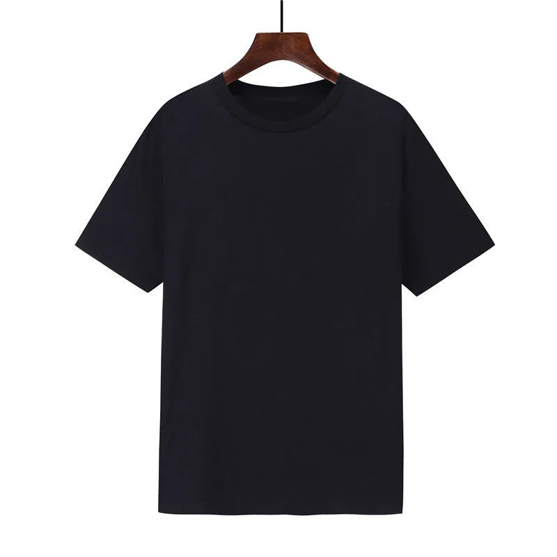 A man's loose-fitting black cotton t-shirt with short sleeves laid flat.