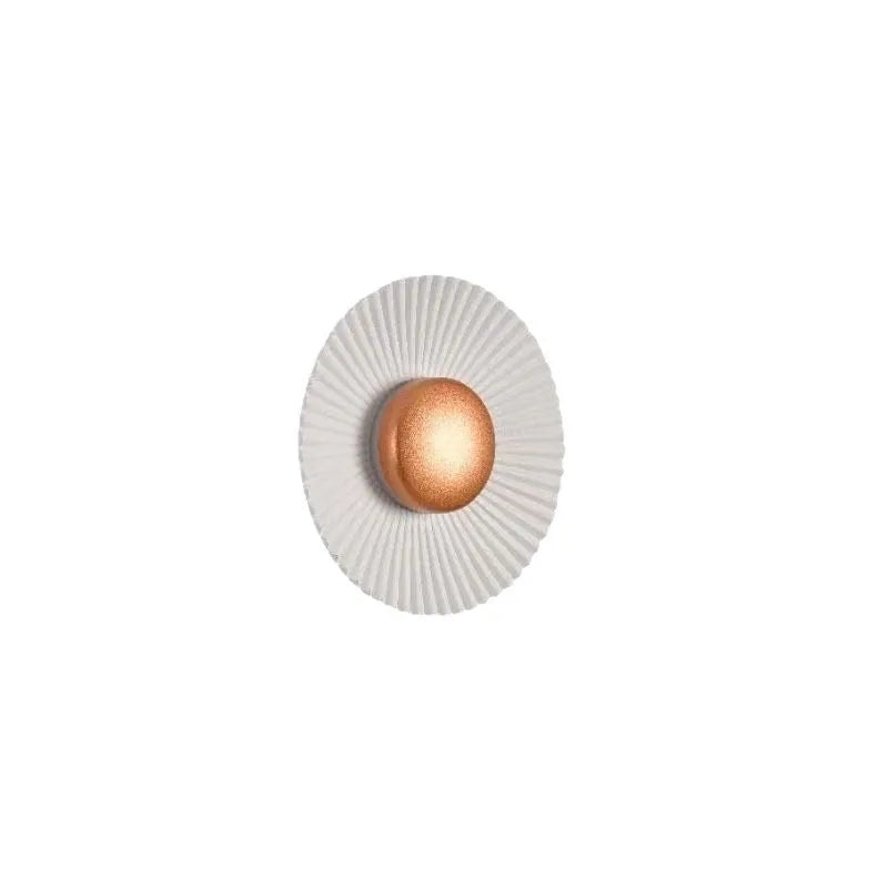 Round aluminium LED wall lamp in a dual-colour finish mounted on a wall.