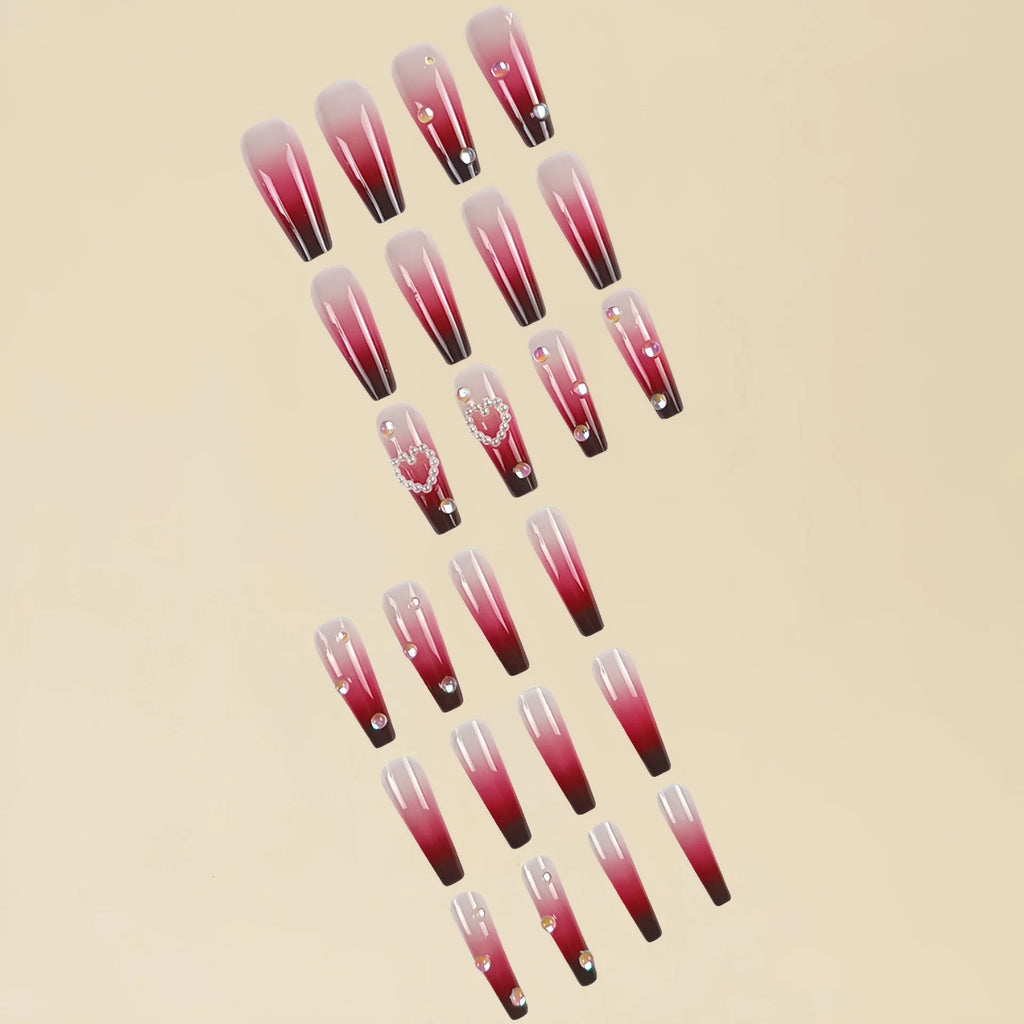 Wine red gradient fake nail tips with plaid pattern in long ballet style displayed with jelly glue applicator