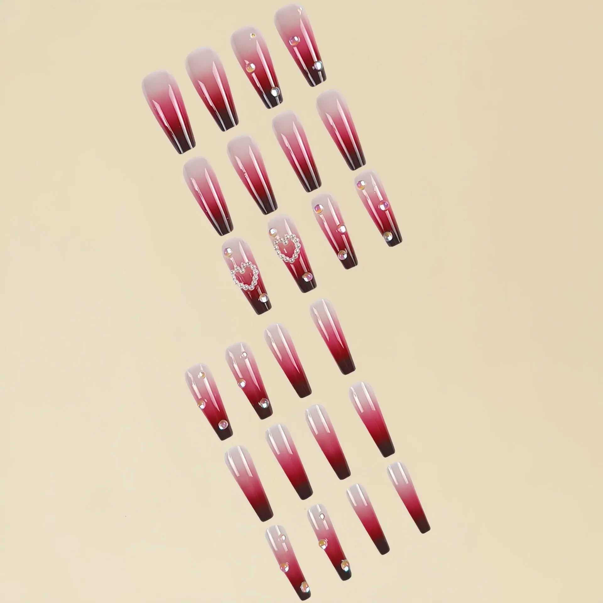 Wine red gradient fake nail tips with plaid pattern in long ballet style displayed with jelly glue applicator