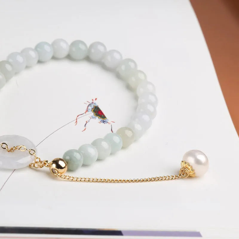 Natural emerald peace buckle pearl bracelet for women with jade round pendant on a geometric design.