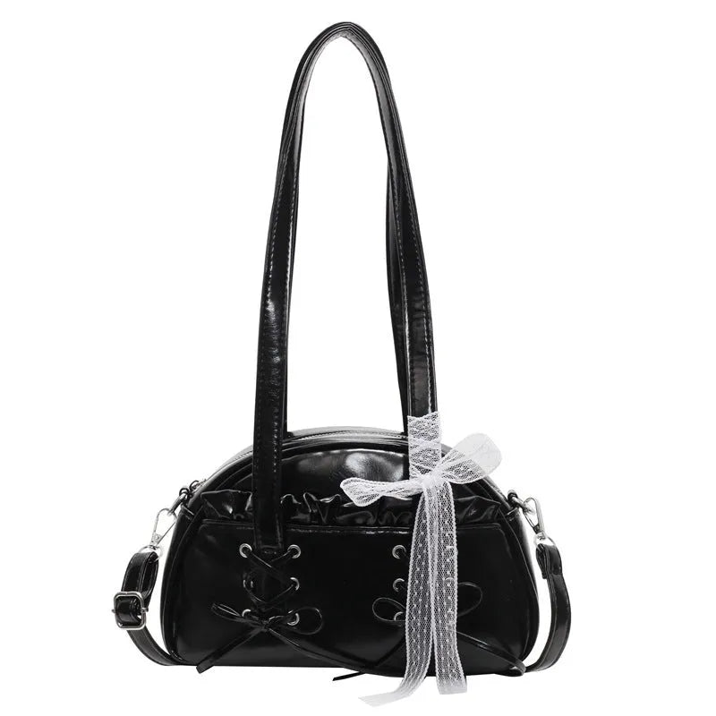 Ladies shoulder handbag with bandage bow design in PU leather showing phone pocket compartment