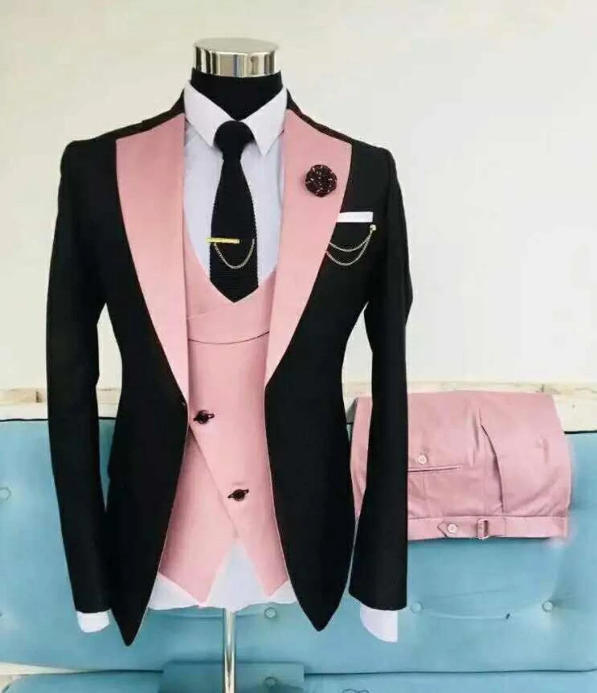 Men's slim fit three-piece business suit in cotton, showing coat, vest, and trousers on a hanger.