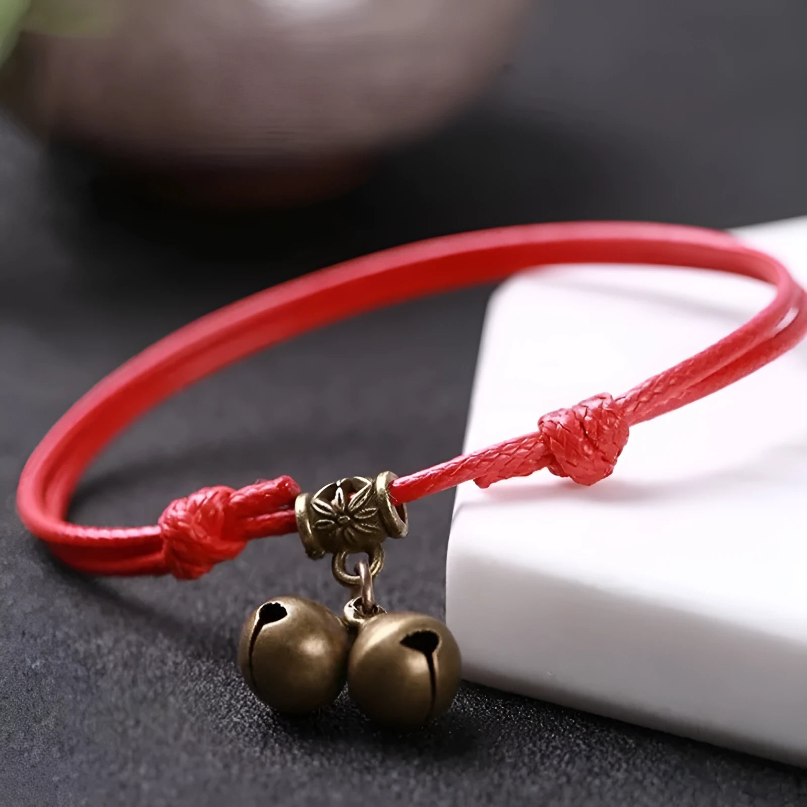 Adjustable nylon dog collar with brass buckle or bell in black, red, or coffee rope colour.