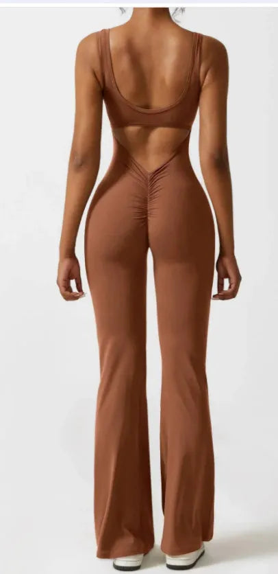 Black women's tight seamless yoga bodysuit with a mid waist and trousers length.