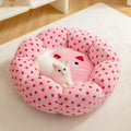 Pink dot circular cat bed showing two size options for pets up to 8 and 20 pounds