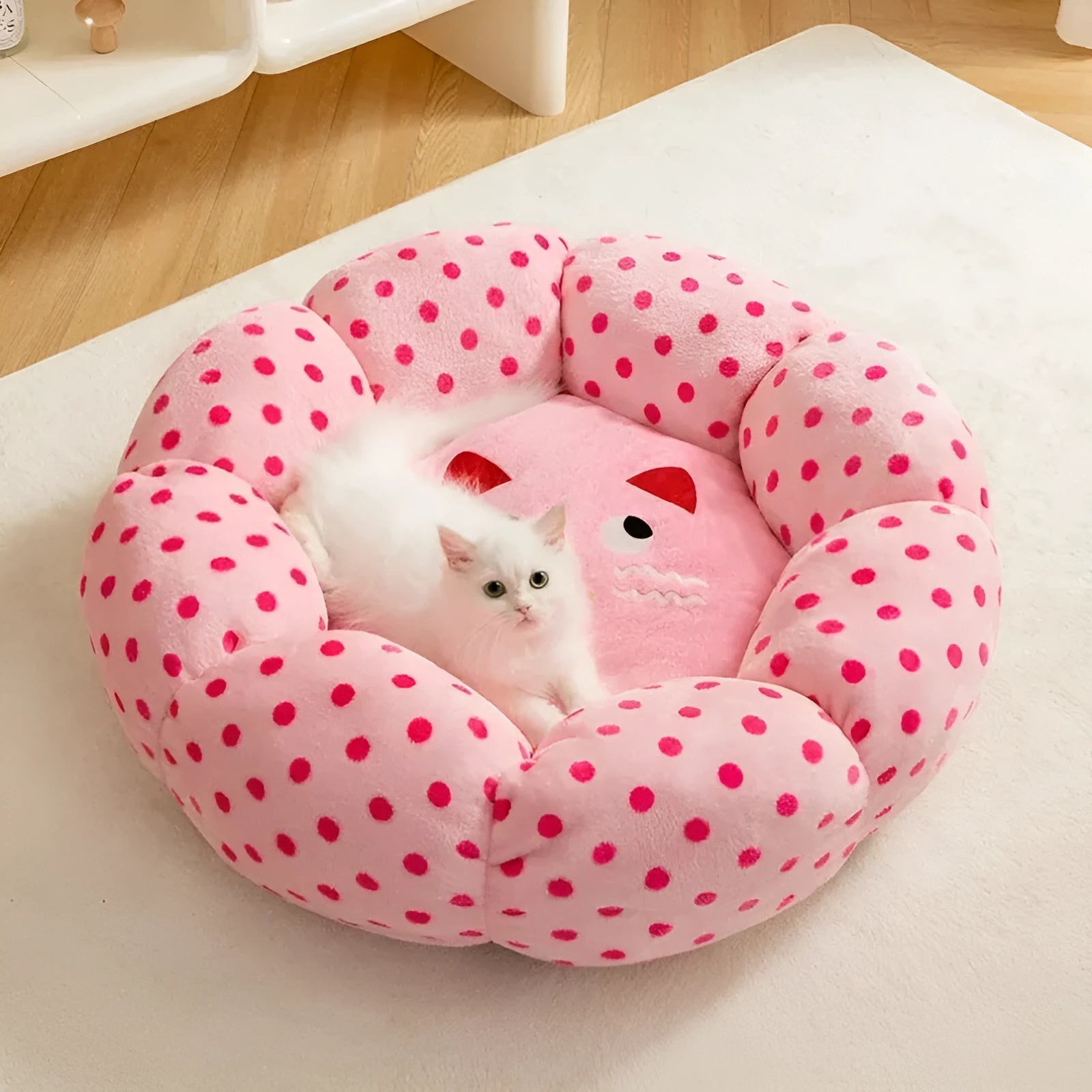 Pink dot circular cat bed showing two size options for pets up to 8 and 20 pounds