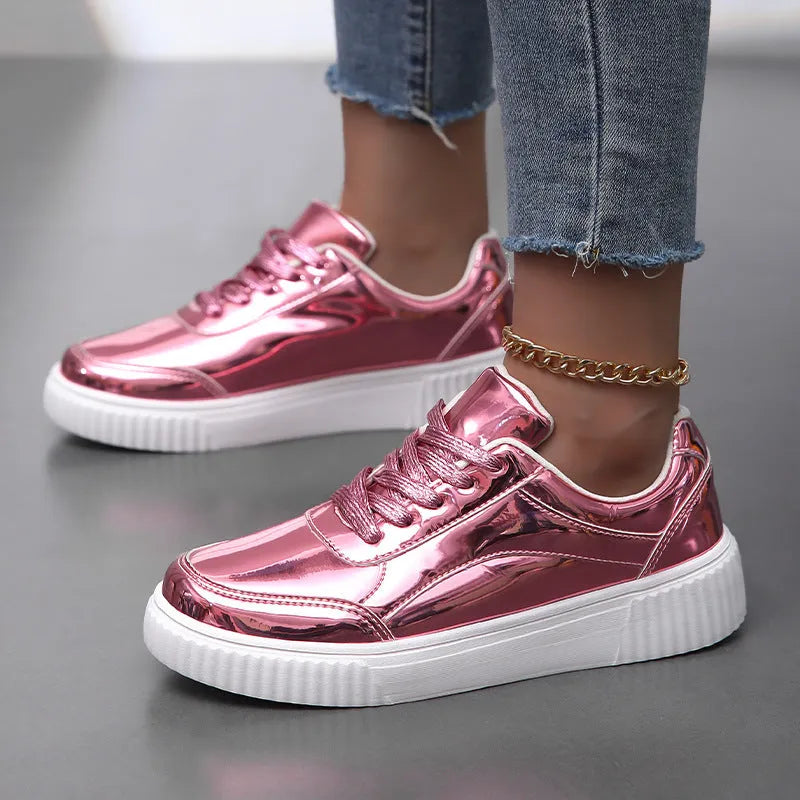Thick-soled sequin sneakers in metallic rose gold with platform heel and round toe