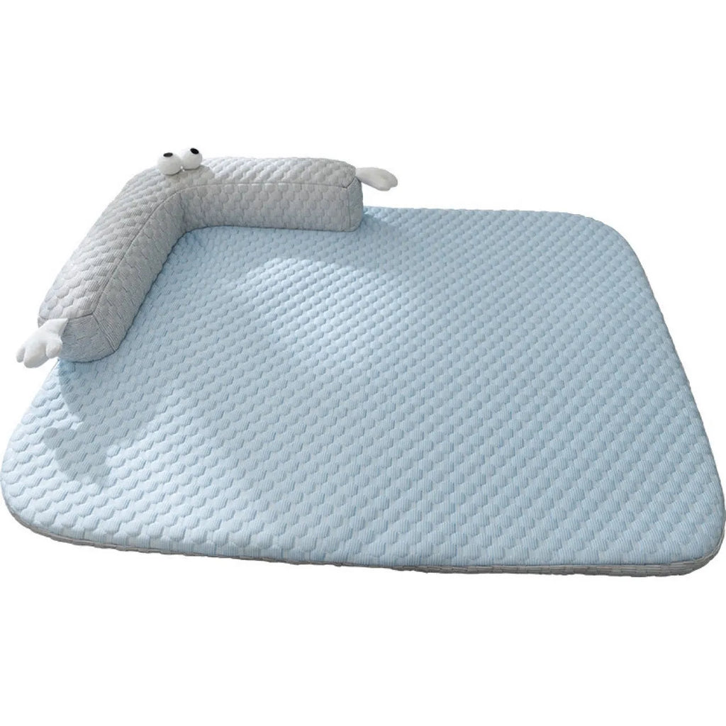 Blue pet cushion with large monster face design for dogs and cats on a wooden floor.