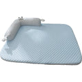Blue pet cushion with large monster face design for dogs and cats on a wooden floor.