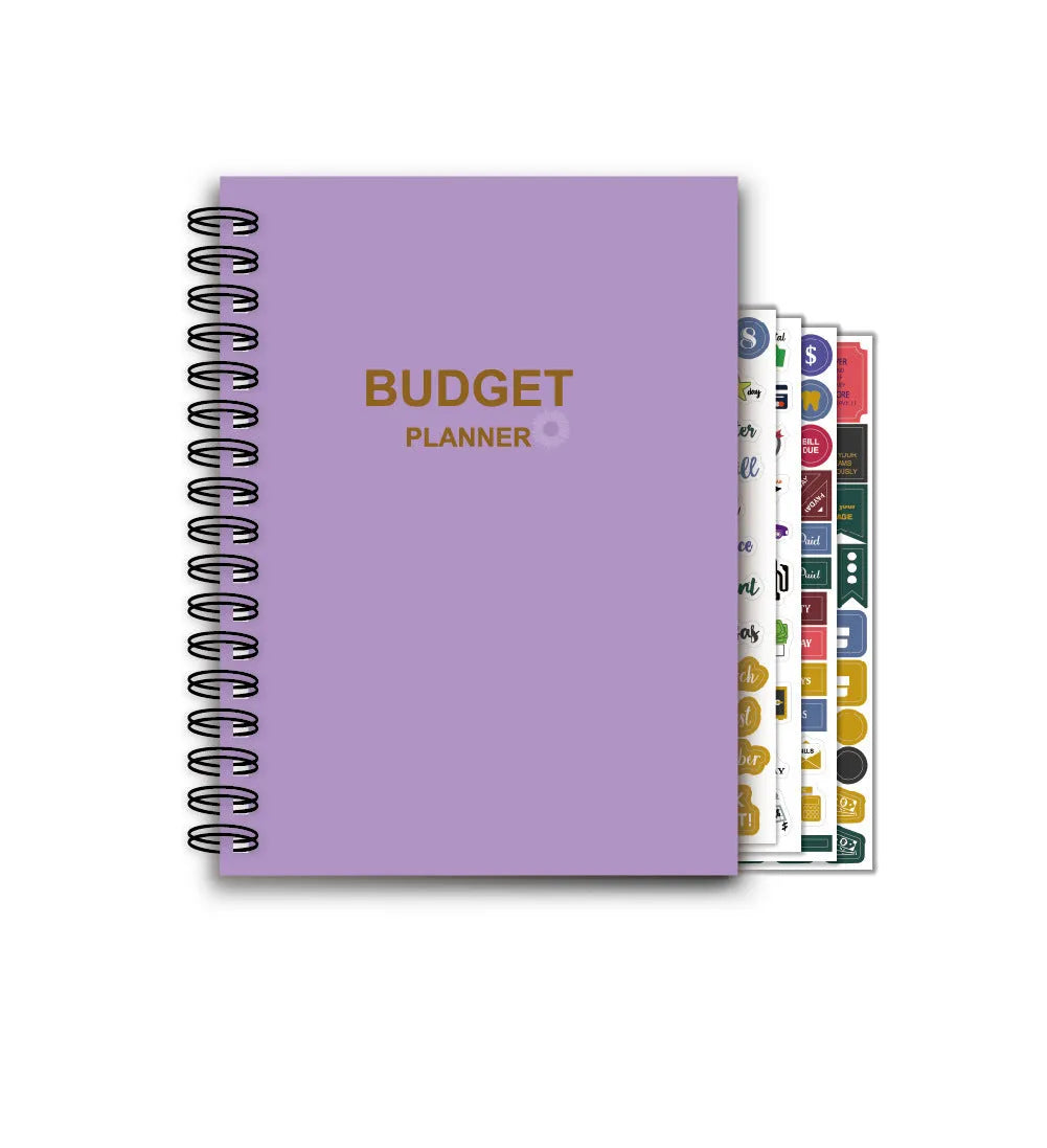 Purple coil-bound financial planning notebook with budgeting stickers and paper clips for monthly expense tracking